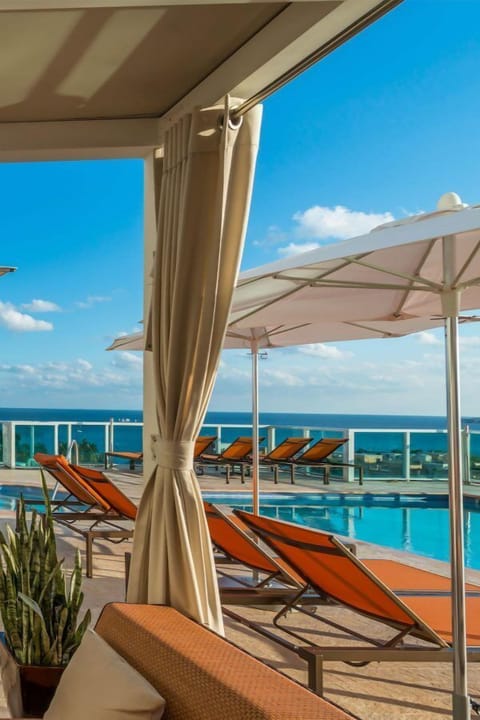 Outdoor pool, open 10:00 AM to 6:00 PM, pool umbrellas, sun loungers