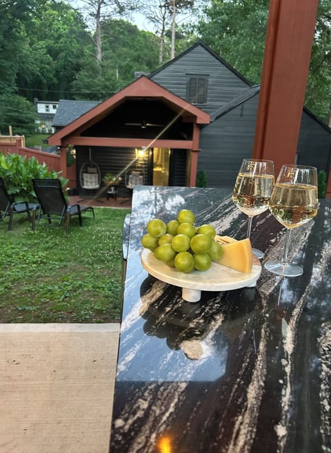 Golden hour pours into the pavilion—wine, charcuterie, and Maybach vibes ✨