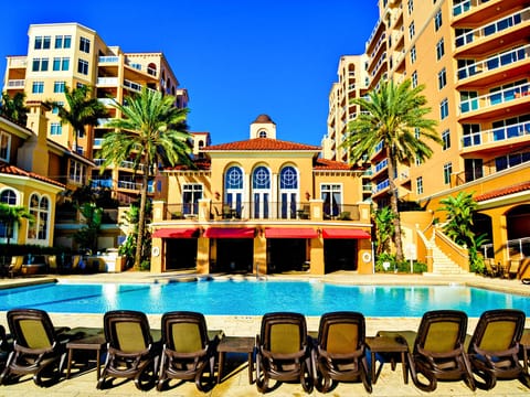 Florida Beach Rentals Belle Harbor pool building loungers table