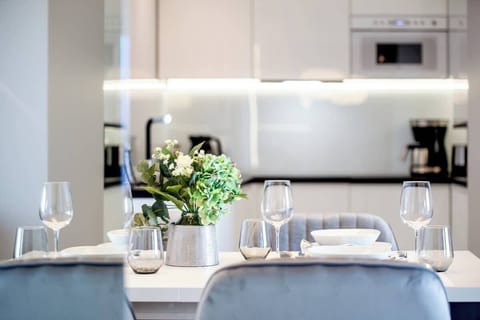 Large table with chairs for eating communal meals. 