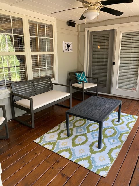 Screened in porch overlooking backyard access from dining room and master room