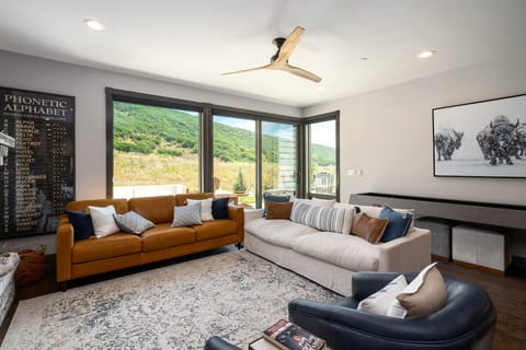 Big windows and large sliding doors open up to the deck, out door space.