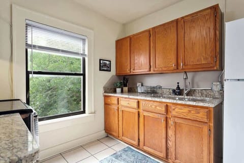 An alternative view of our kitchen, complete with a 4-burner stove, refrigerator with freezer, microwave, and everything else you could need to prepare a full meal.