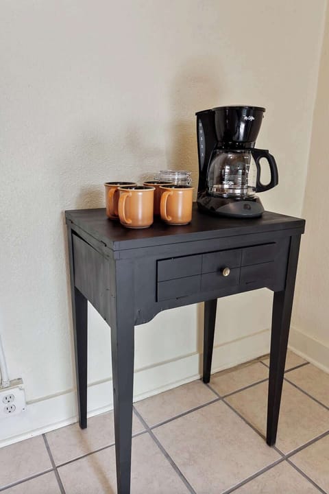 Also in the kitchen, enjoy our place's coffee station complete with a coffee maker & handmade ceramic mug.