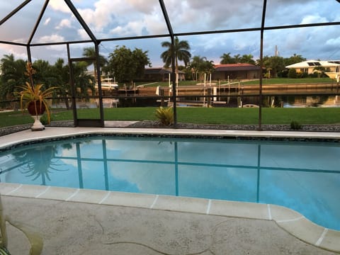Gorgeous saltwater pool view overlooking an extra wide canal for added privacy.