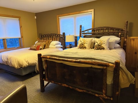 Two queen beds on upper level.