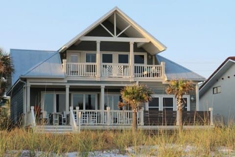 Exceptional beachfront home, meticulously renovated with an exclusive swim spa. Uncompromised luxury in Panama City Beach.