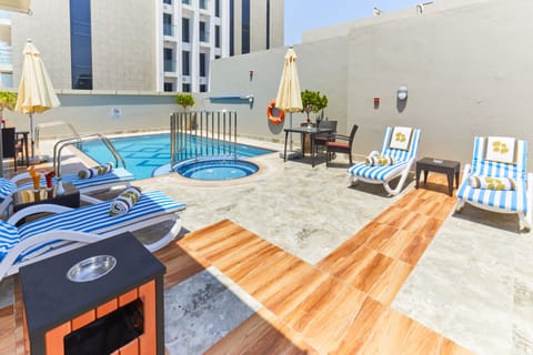 Outdoor pool, open 9:00 AM to 8:00 PM, pool umbrellas, sun loungers