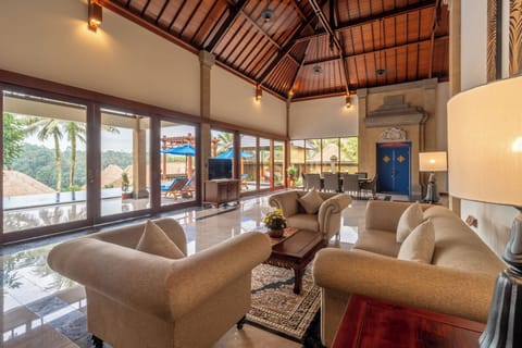 Larasati 4 Bedrooms Villa, Private Pool | Living area | 29-inch TV with satellite channels, fireplace, DVD player