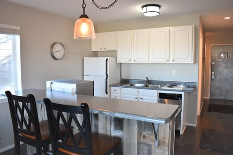 Deluxe Condo (1st Floor, Dunes View) | Private kitchen | Fridge, microwave, coffee/tea maker, cookware/dishes/utensils