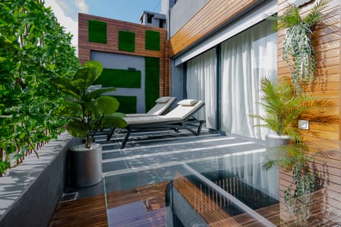 Presidential Suite, 1 King Bed | Living area | 44-inch flat-screen TV with satellite channels, TV