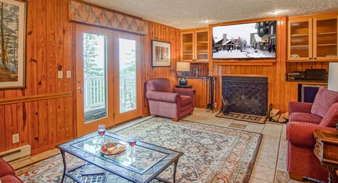 Here you can see the wood fireplace and the balcony doors in the living room.