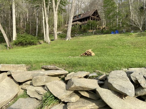 View from the river past the fire pit up to the house. 