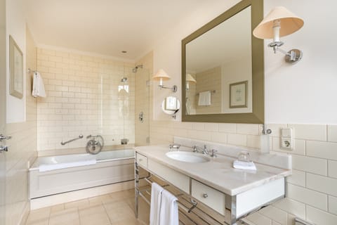 Combined shower/tub, hair dryer, towels, soap