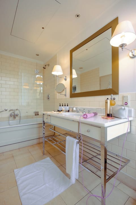 Combined shower/tub, hair dryer, towels, soap