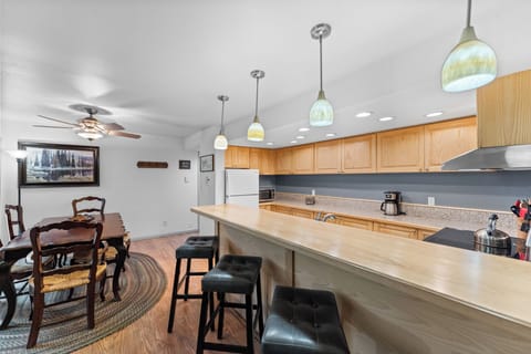 The kitchen has a breakfast bar with seating for 4.