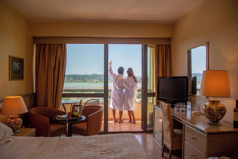 Superior Pool View, Triple Room | Minibar, in-room safe, desk, laptop workspace