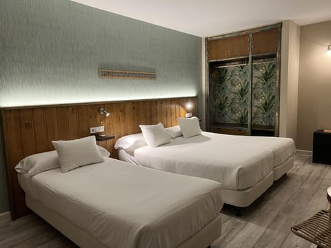 Standard Triple Room, Private Bathroom | In-room safe, desk, blackout drapes, soundproofing