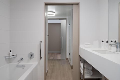 Suite, 1 King Bed, Accessible, Bathtub (Mobility & Hearing) | Bathroom | Combined shower/tub, designer toiletries, hair dryer, towels