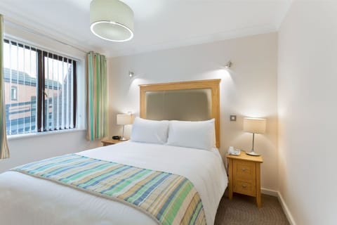 Restful bedroom with fresh linens for a peaceful night's sleep.