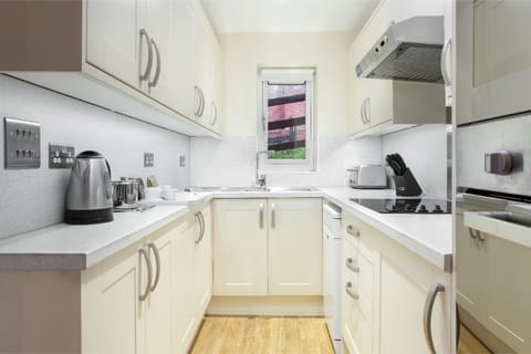 Compact and efficient galley kitchen, perfect for culinary enthusiasts.