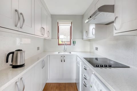 Bright kitchen space with all the essentials for home-cooked meals.