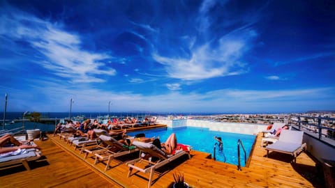 Seasonal outdoor pool, open 11:00 AM to 8:00 PM, pool umbrellas