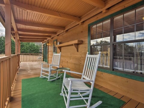Rustic Refuge offers front porch sitting—or napping.