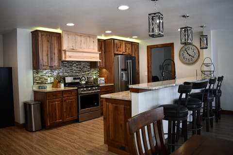 Beautiful large kitchen with dishes, glass, cookware.