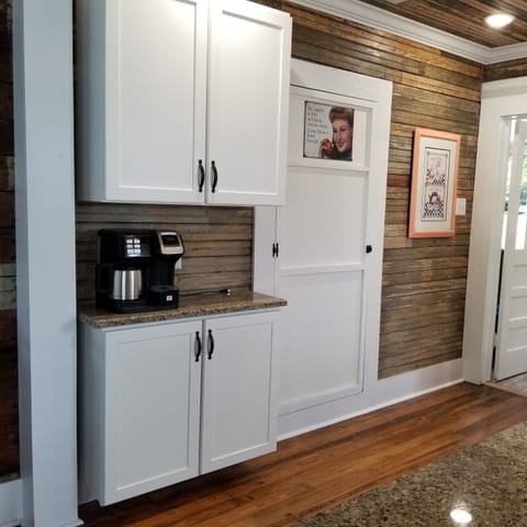 Coffee station has combination drip pot/Keurig.