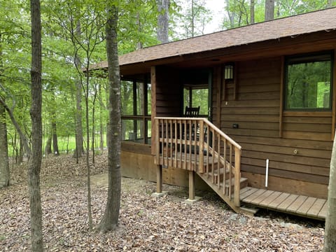 Cabin front door during the Spring and Summer when trees are in bloom