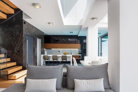 Open plan living space featuring the seating area and kitchen