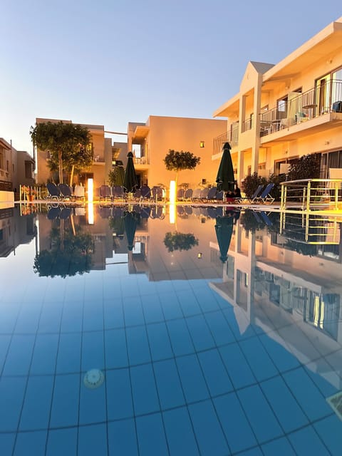 Seasonal outdoor pool, open 9:00 AM to 7:00 PM, pool umbrellas