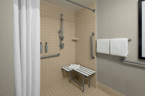 Combined shower/tub, designer toiletries, hair dryer, towels