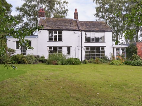 Lawned garden with patio and garden furniture | The Mill Cottage, Heath, near Chesterfield