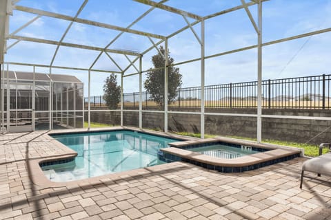 Dive into your private screened pool and spa, perfectly heated for year-round enjoyment under Florida's sunny skies.