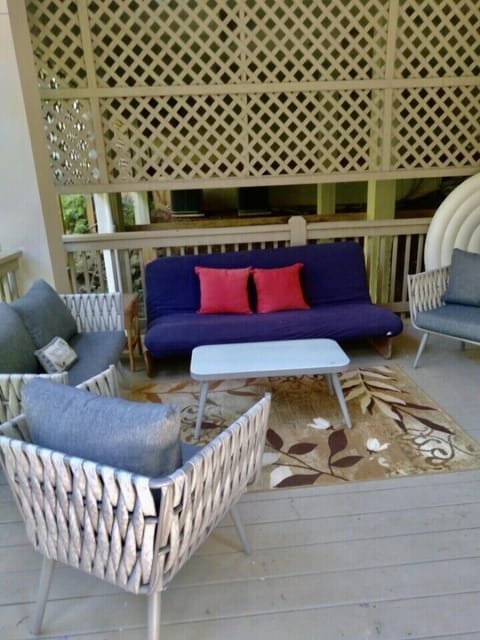 Very large lower level deck with dining seating area and hot tub