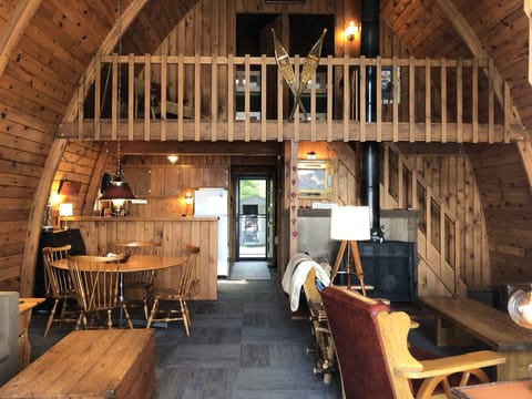 Interior of chalet with a 20-foot cathedral ceiling and a wood-burning stove