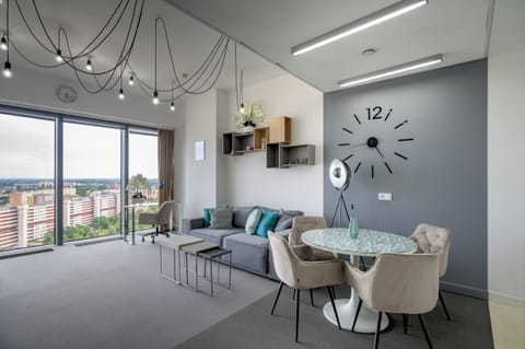 Exclusive Apartment | Living area | 30-inch TV with cable channels