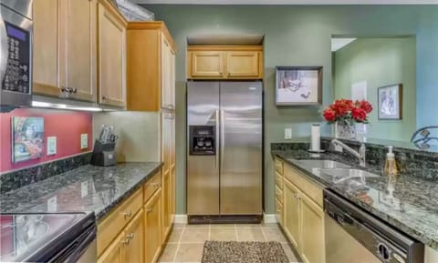 Kitchen with granite countertops and stainless appliances.