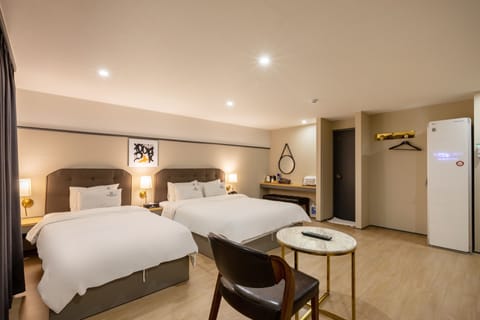 VIP Twin | Premium bedding, individually decorated, desk, laptop workspace