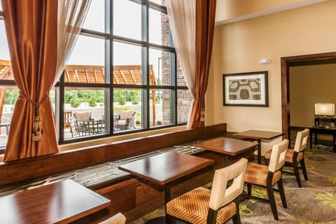 Window seating with views of the outdoor patio — afternoon light makes this a good place to read or work