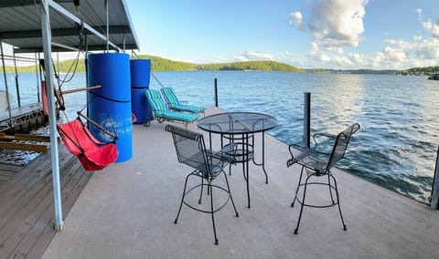 Fantastic carpeted entertainment area on the dock. Stays cool in the sun!