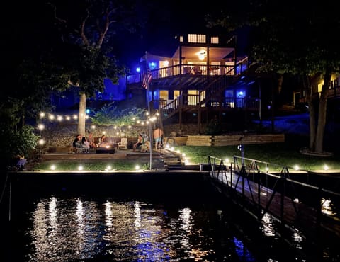 Fire pit and lawn are nicely lit at night, perfect for relaxing or entertaining!