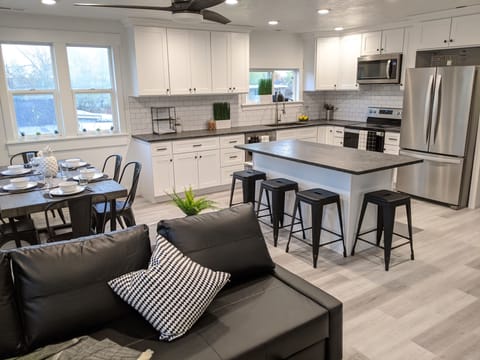 Alternate view of kitchen and dinning room area. The couch is also a bed.