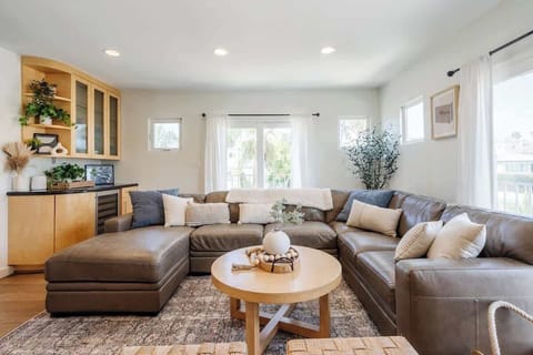 Relax and unwind  in the bright, sun-filled living space