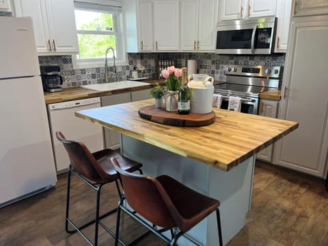 spacious countertops w/ additional island perfect for snacking, meals, & hosting