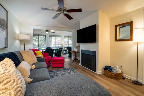 Living room features 55" Smart TV and ceiling fan.  
*Fireplace decorative only - not for use.*