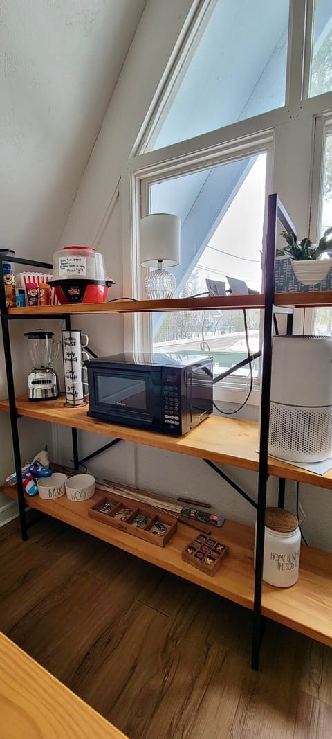 Activities Shelf - full of popcorn machine, dog toys, brain games