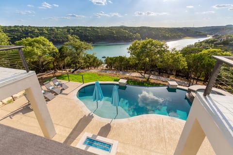 Stunning view from balcony overlooking patio and lake